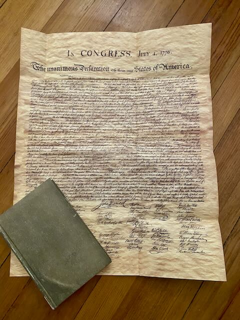 The dust jacket of Signing Their Lives Away fully unfolded, displaying a replica of the Declaration of Independence. A unique collector's feature of this Quirk Books first edition.