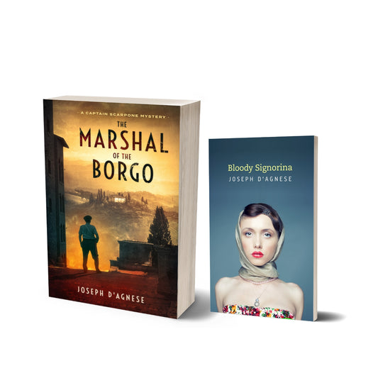 Italian Paperback Mystery Bundle book cover by Joseph D'Agnese, featuring a 3D mockup of two paperback books: 'The Marshal of the Borgo' and 'Bloody Signorina' sitting side-by-side. The covers depict a moody Italian village and a woman enveloped in a head scarf, symbolizing a physical collection of Captain Scarpone mysteries.